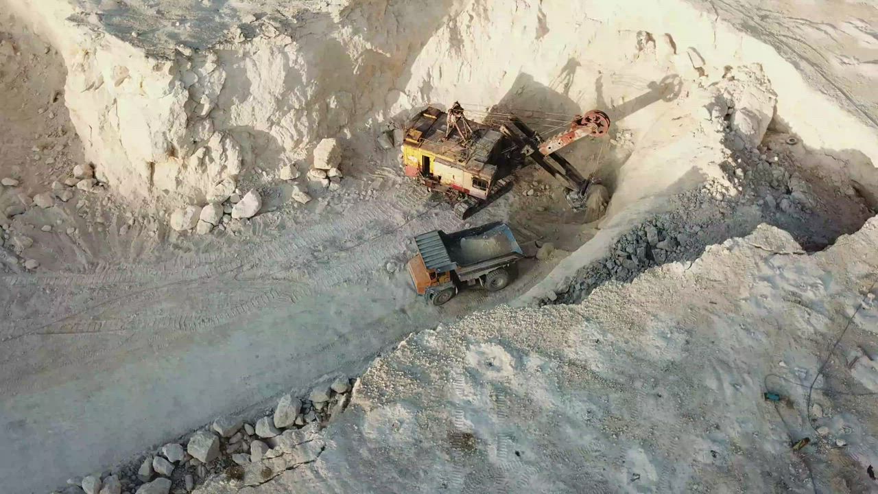 Opencast mining quarry with heavy machinery at work